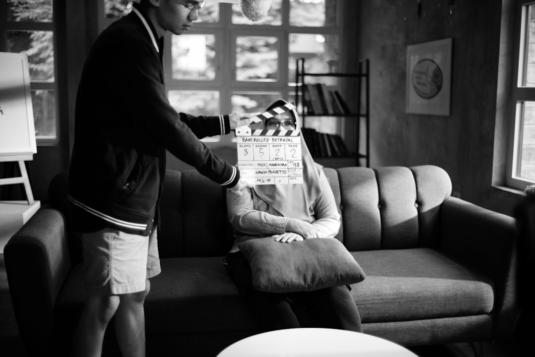 Diverse television production crew reviewing a shot list together